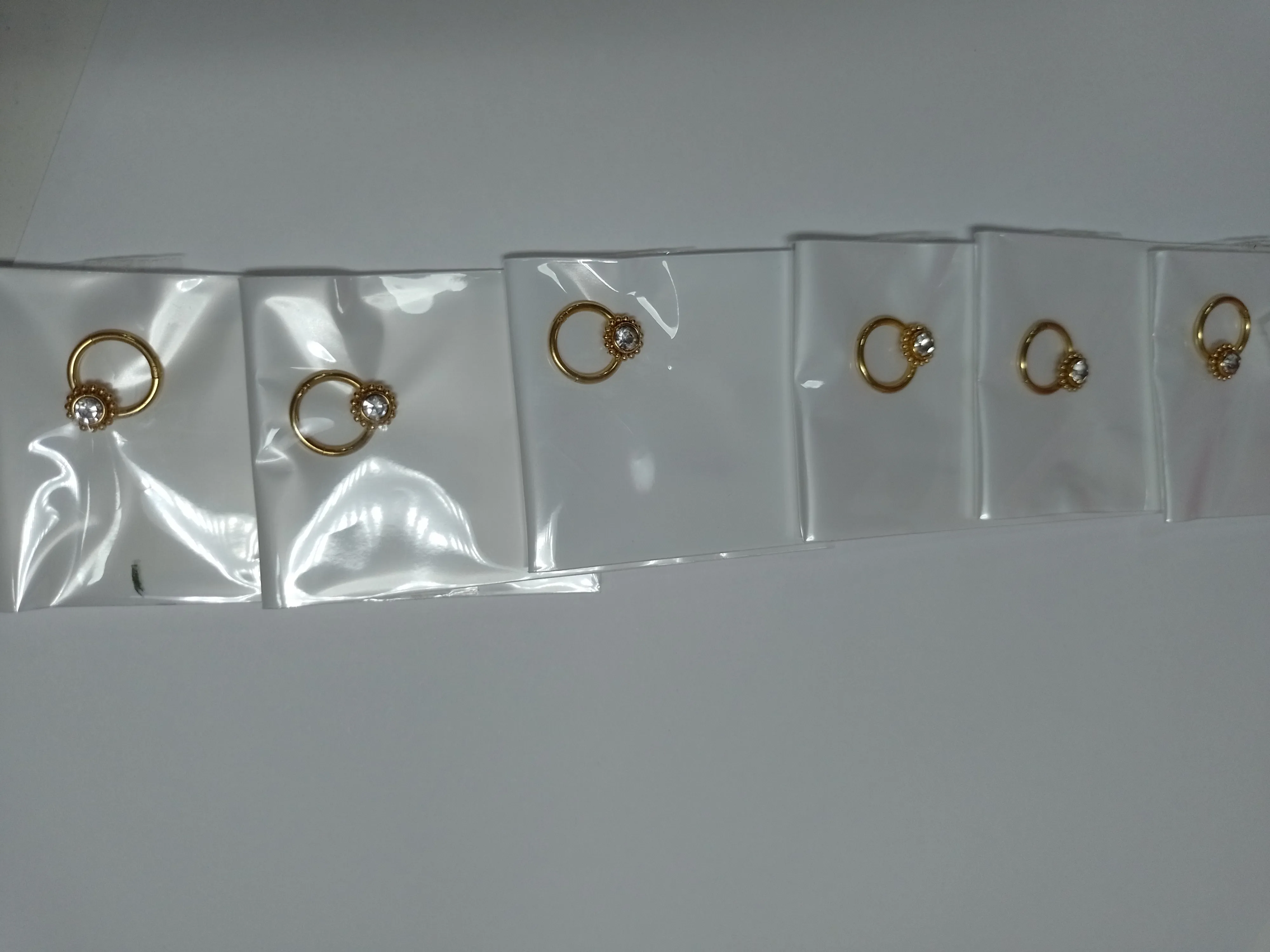 arito tipo piercing acero dorado
